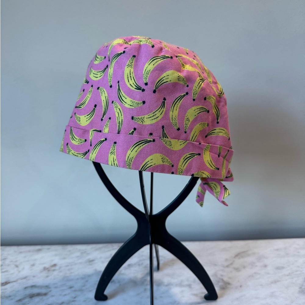 Pink scrub cap with bananas